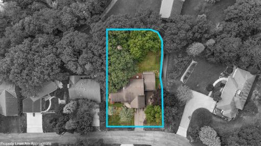 Back of property is a wooded ravine and paved trail west and south side of property.