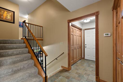 Off the entrance is staircase and garage entrance