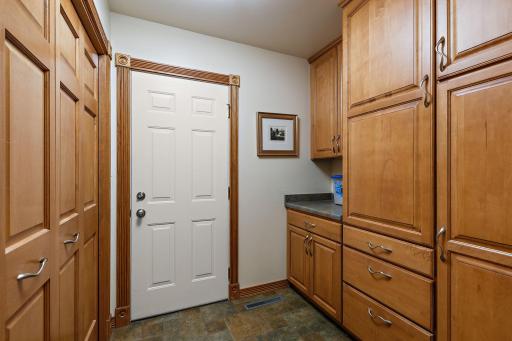 Garage entrance offers large closet and built in storage~