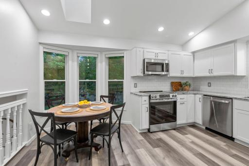 The charming bay window creates a natural spot for a breakfast nook or informal dining.