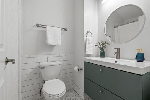 Beautifully refreshed, upper-level full bath! Also updated in 2023 with a floating vanity and convenient hall storage.
