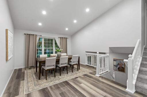Just beyond, the additional dining area offers flexibility as a more formal setting or a comfortable sitting room.