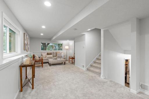 Downstairs, a generous family room provides plenty of room to make the space your own.