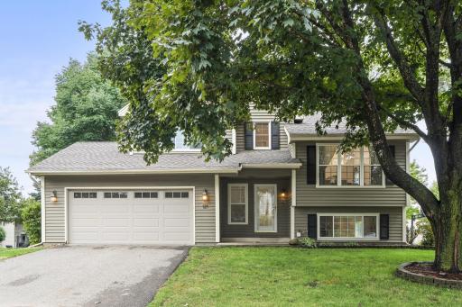 An attached two-car garage provides welcome convenience through every Minnesota season and includes built-in shelving and a workbench for storage and projects.
