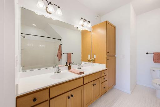 Oversized vanity with ample storage, a built-in linen closet and shower/tub combo make this primary bathroom a true oasis.