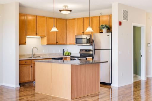 Extensive cabinetry, large center island and stainless steel appliances make this kitchen a dream!