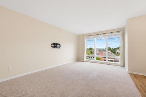 Floor to ceiling windows flood the living room with natural light
