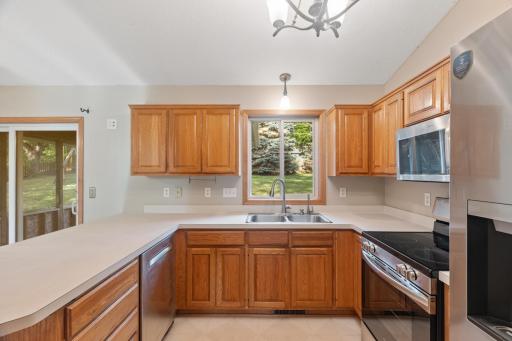 The kitchen has a new range, microwave and refrigerator.