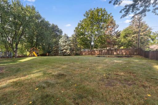 There is a nice area for a garden in the corner of the yard.