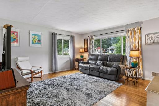 18x15 main Floor living room with Hardwood floors and fresh paint. South and west-facing windows.