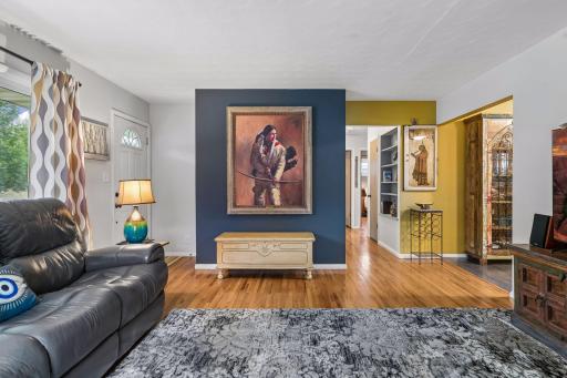 18x15 main Floor living room with Hardwood floors and fresh paint. South and west-facing windows.