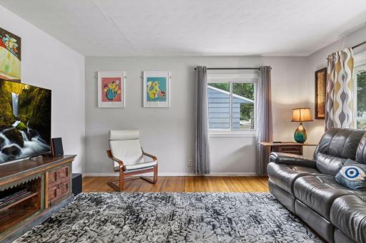 18x15 main Floor living room with Hardwood floors and fresh paint. South and west-facing windows.