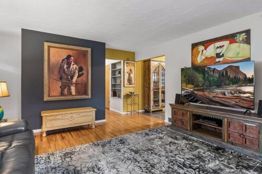 18x15 main Floor living room with Hardwood floors and fresh paint. South and west-facing windows.