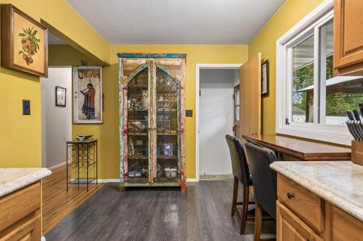 17x8 Main floor Kitchen with oak cabinets, laminate flooring and East-facing windows