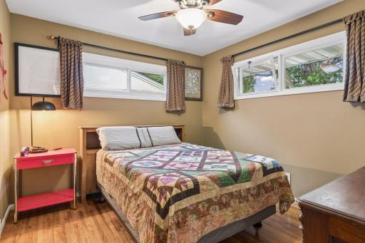 11 x10 Bedroom #2 with hardwood floors, fresh paint and East and north-facing windows.