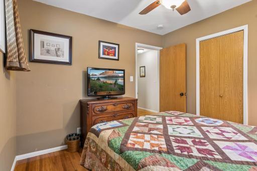 11 x10 Bedroom #2 with hardwood floors, fresh paint and East and north-facing windows.