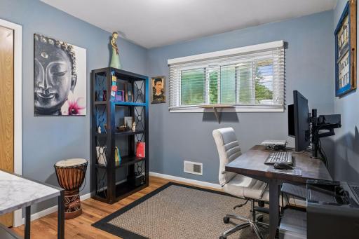 9x9 Main floor Bedroom #3 with hardwood floors, fresh paint and west-facing windows.