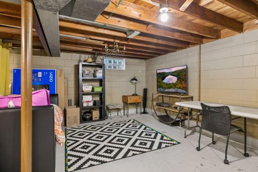 Lower-level unfinished Full Basement with Laundry and a washing sink plus an east-facing egress window. Ready for your finishing ideas.