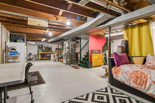 Lower-level unfinished Full Basement with Laundry and a washing sink plus an east-facing egress window. Ready for your finishing ideas.
