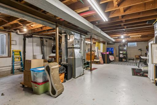Lower-level unfinished Full Basement with Laundry and a washing sink plus an east-facing egress window. Ready for your finishing ideas.