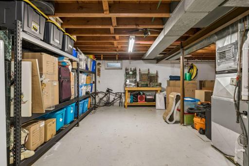 Lower-level unfinished Full Basement with Laundry and a washing sink plus an east-facing egress window. Ready for your finishing ideas.