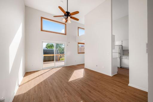 Soaring ceilings & large windows make this room bright and airy.