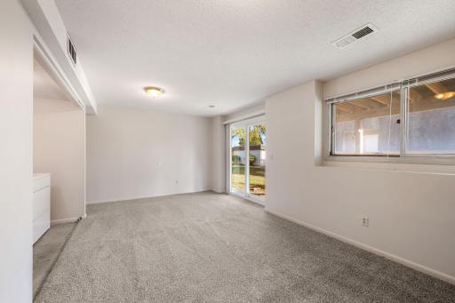 Lower level rec room with walk-out to garden patio.