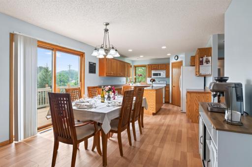 Informal dining area off the Great room with sliding glass door out to the deck.