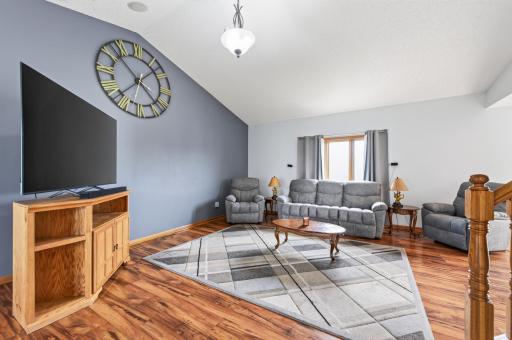Large vaulted Great room with laminate flooring.