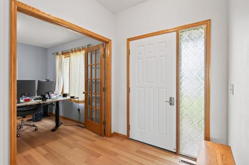 Spacious entryway with easy care laminate flooring. Adjoining 4th Bedroom or Office with 15 light glass doors for the work from home needs.