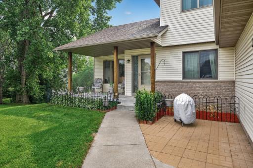 Desirable porch front for those relaxing summer evening. Adjoining paver patio for the grills.