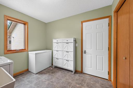 Another view of the laundry/mudroom with single casement window and double wide closet.