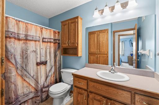 Main full bathroom upstairs with built in linen closet and medicine cabinet.