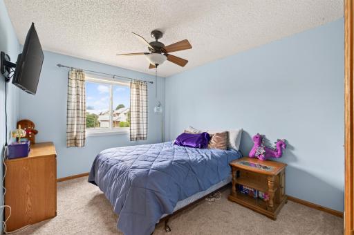 Bedroom # 2 upstairs with new carpeting and new Andersen renewal glider window.