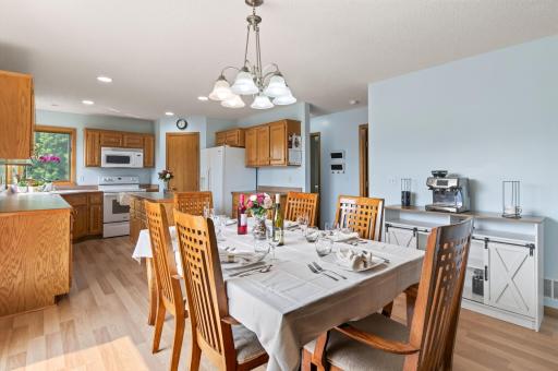 Informal dining area with laminate flooring.