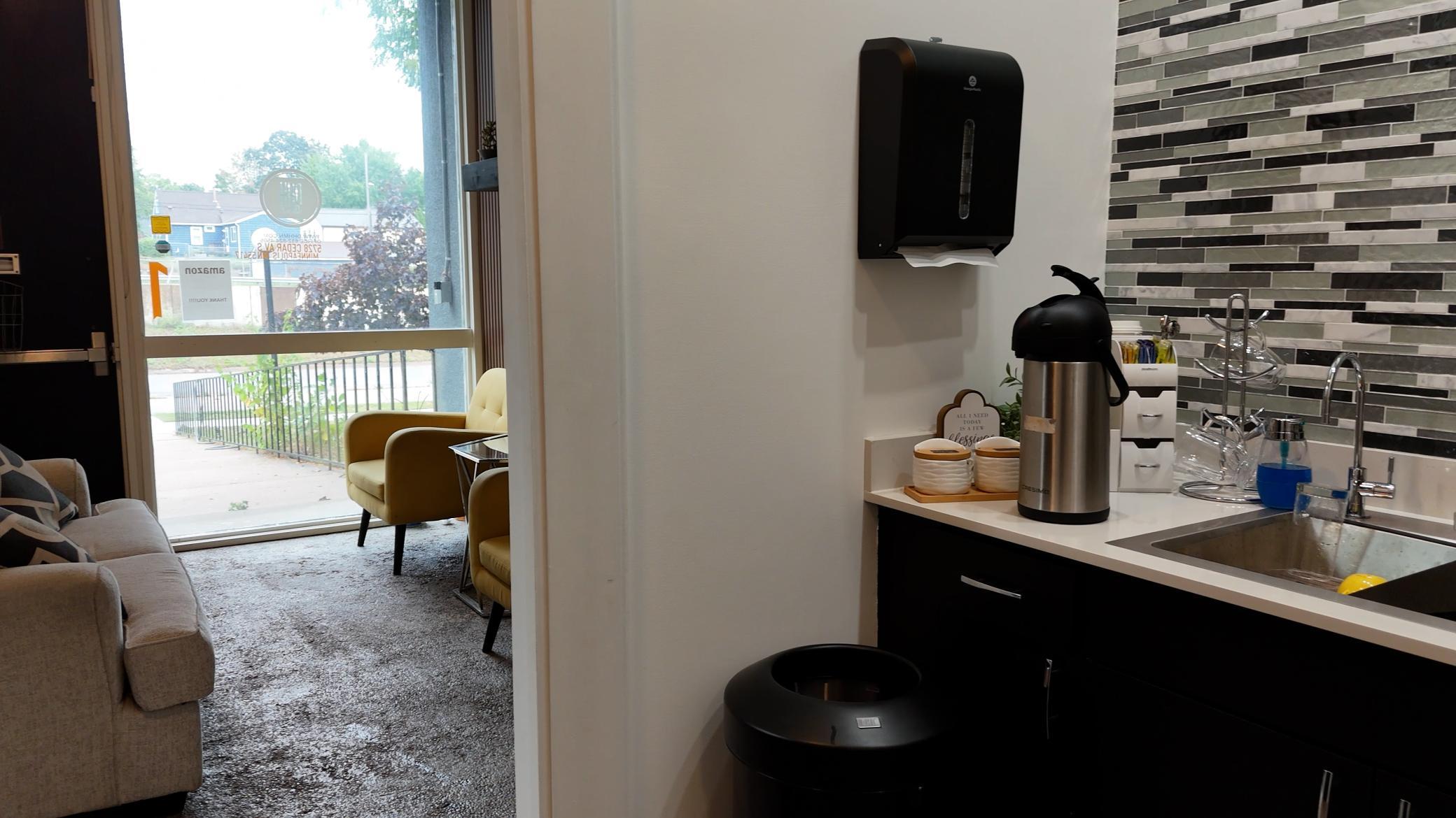 Office wing includes a kitchenette for staff and guests.