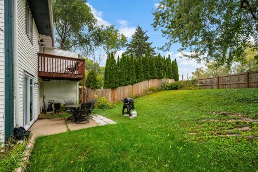 Step out from the dining room onto the deck with a private view, or walk out to the patio from the lower levelâboth featuring new patio doors.