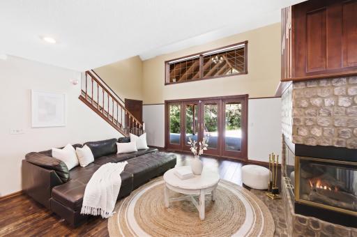 5994 425th St - Living Room with Vaulted Ceilings, Hardwood Floors, and Floor to Ceiling Custom Fireplace