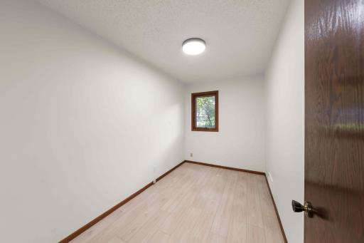 Versatile main-level flex room ideal for a home office, study, hobby space or quiet retreat