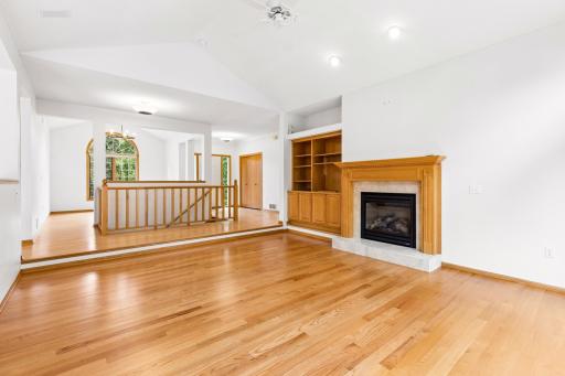 Vaulted ceiling in the living room, front formal dining room and primary bedroom.