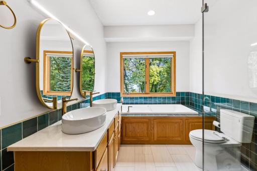 Soak in the whirlpool tub and catch views of the treetops.