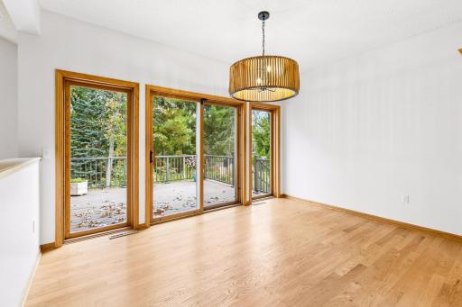 Another wall of glass showcasing the backyard with a sliding glass and two fixed glass units for greater views!