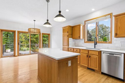 Huge informal dining space can accommodate an 8 person rectangular table.