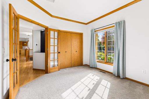One of two main floor bedrooms. Versatile office or studio with the French doors.