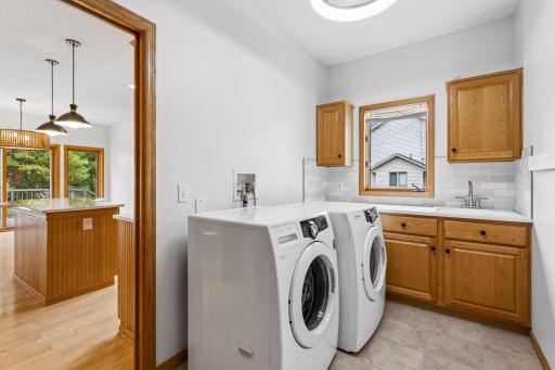 Main floor laundry/mudroom with new countertop and backsplash.