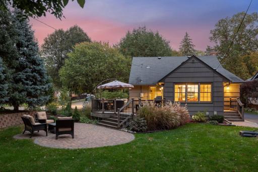 The yard is tastefully landscaped with a variety of lush plantings, numerous trees, bushes & shrubs, all creating a private, inviting outdoor space.