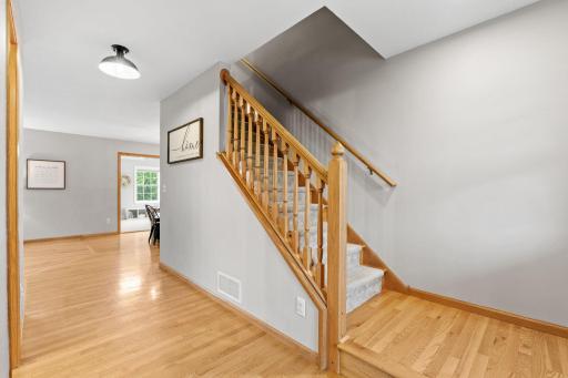 foyer leading to living room and stairway upstairs