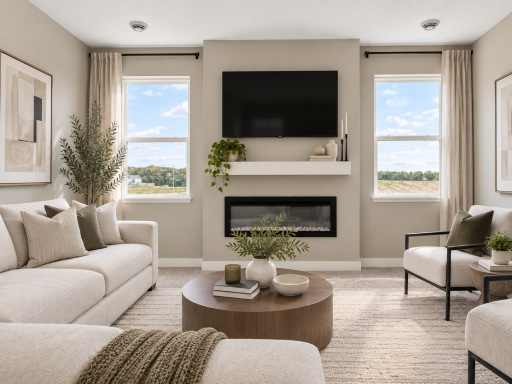 Spacious living room with tons of natural light. *Photo of similar home. Virtually staged.