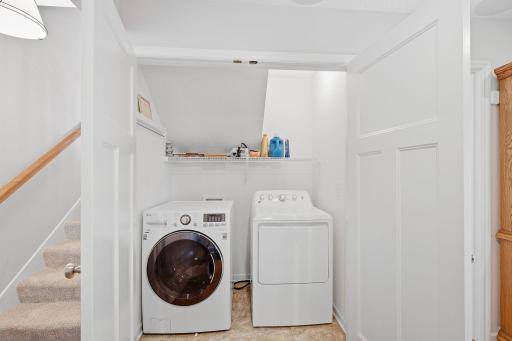 Laundry on lower level with GE washer and dryer.