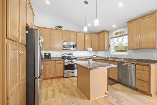 Vaulted kitchen with stainless steel appliances, and an abundance of light!